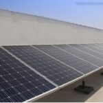 Solar panelled home with rooftop solar panels generating clean renewable energy from sunlight.