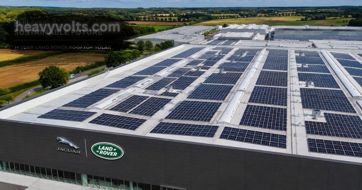 Jaguar Land Rover rooftop solar installation featuring large photovoltaic solar panels covering a manufacturing facility roof, showcasing renewable energy, clean electricity generation, and sustainable automotive production.