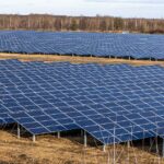 Large solar farm with rows of solar panels showing solar technology advantages for clean energy generation