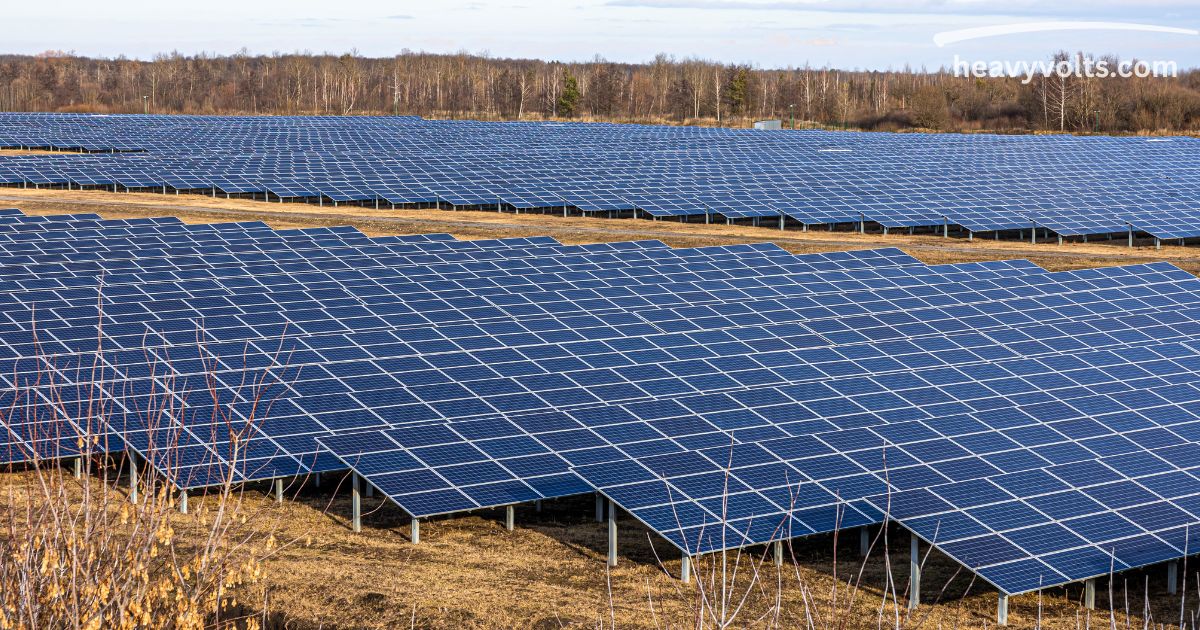 Large solar farm with rows of solar panels showing solar technology advantages for clean energy generation