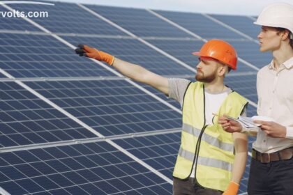 Installing solar panels on a home roof for energy savings.