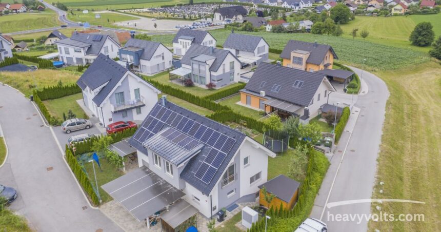 Solar panels installed on a home roof for clean household energy.