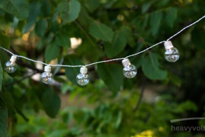 Solar string lights glowing softly in an outdoor garden space