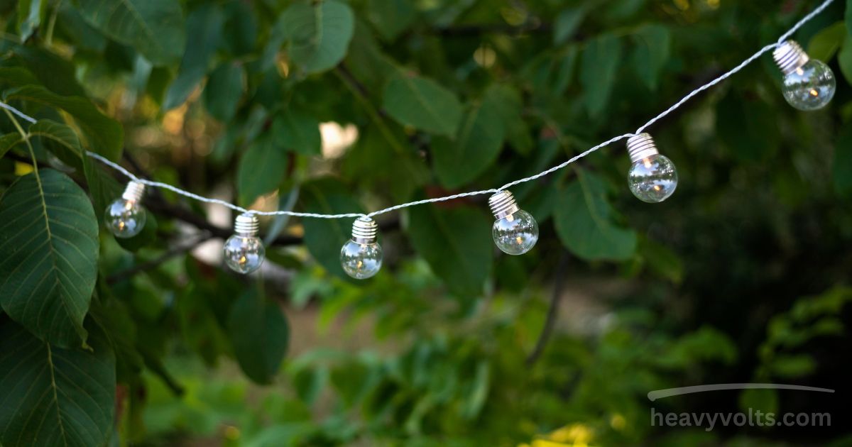 Solar string lights glowing softly in an outdoor garden space